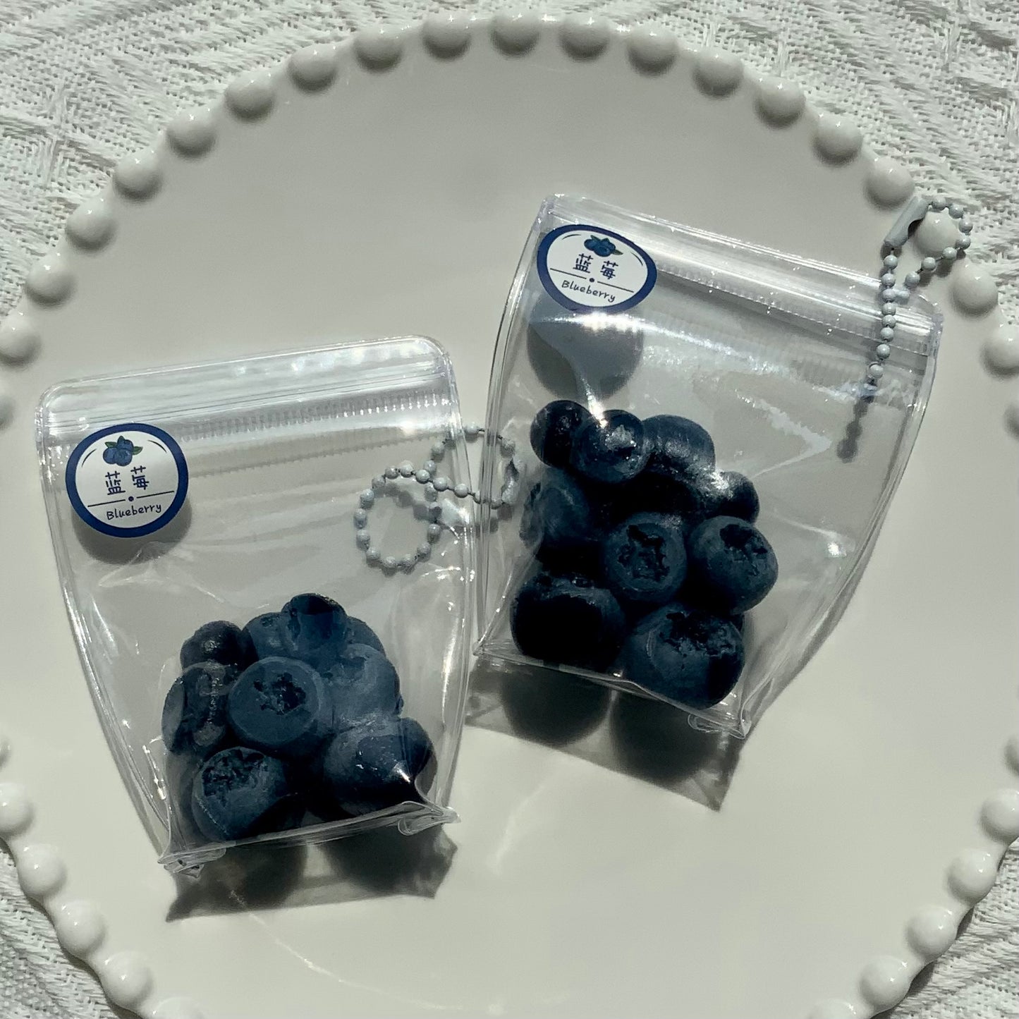 A small bag of blueberries 🫐 taba squishy toy pendant - Charming Cheese