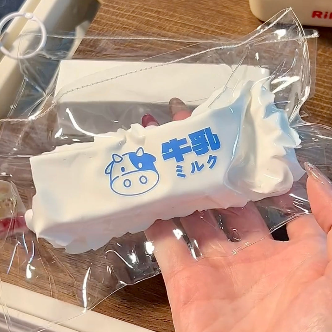 Soft cream-like texture milk strip taba squishy toy