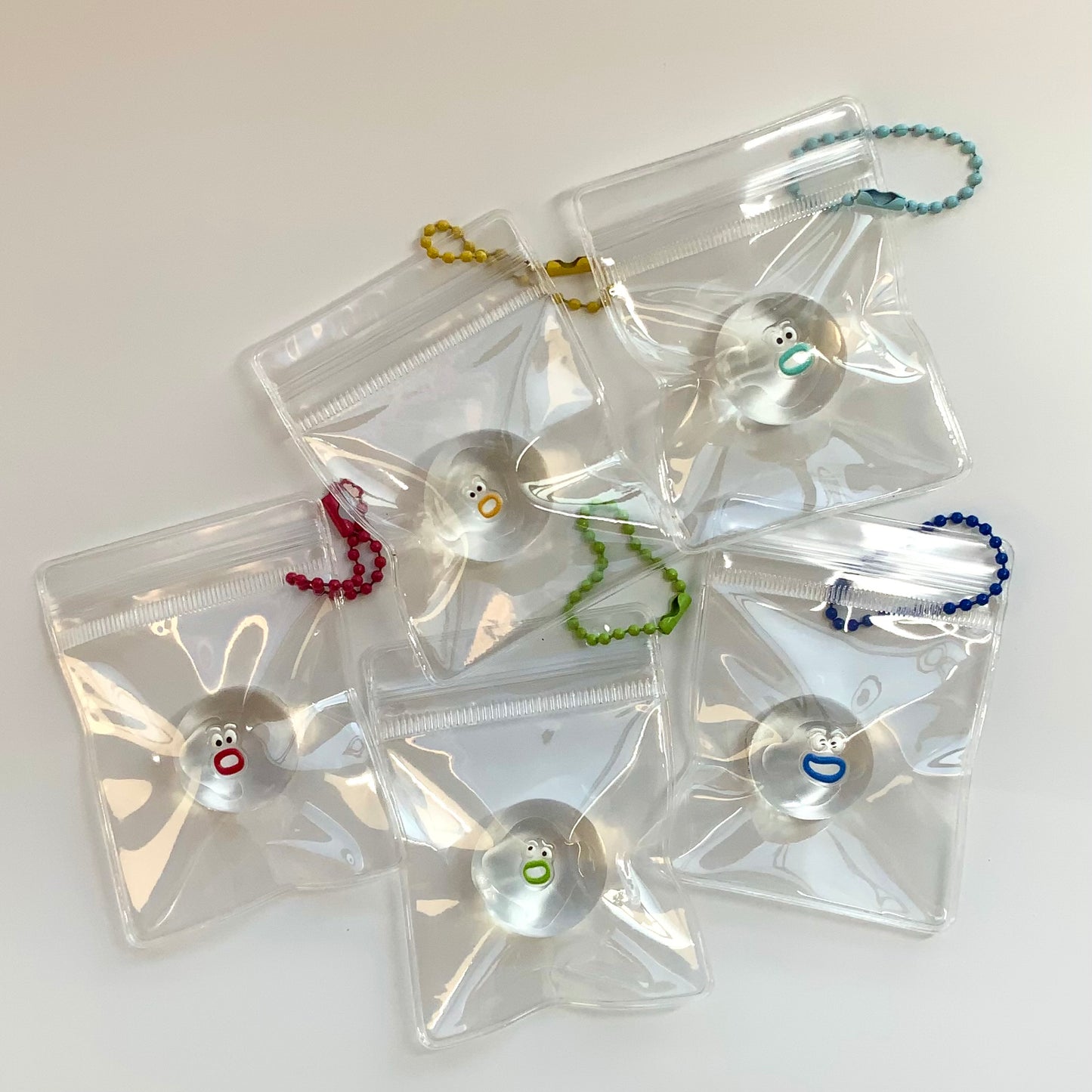 Transparent quirky little emojis taba squishy toy pendant (random color) - Charming Cheese