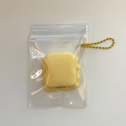 Melted smiling cheese taba squishy toy