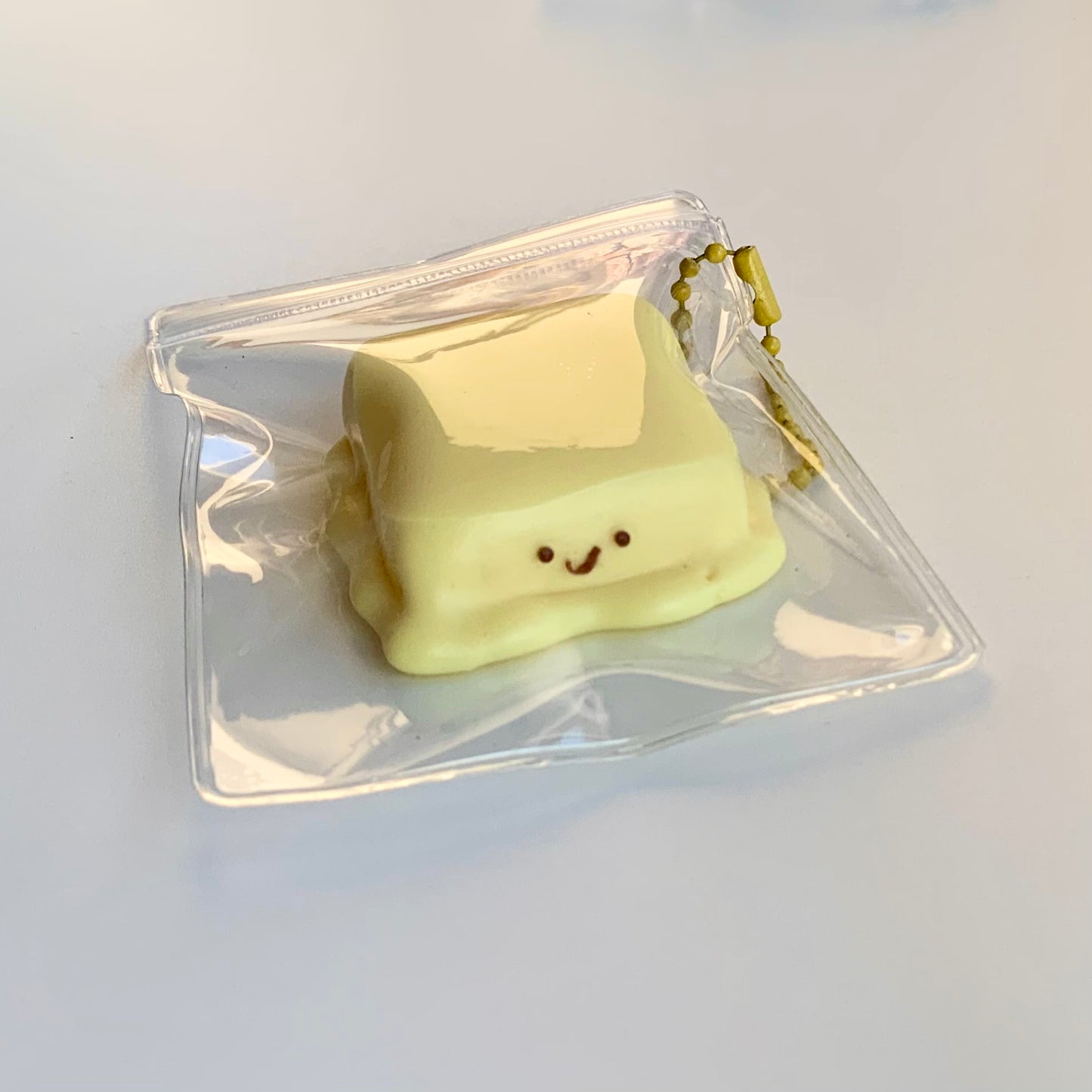 Melted smiling cheese taba squishy toy