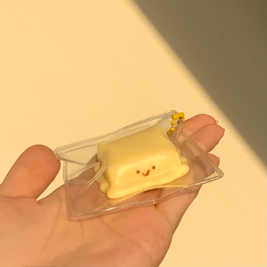 Melted smiling cheese taba squishy toy