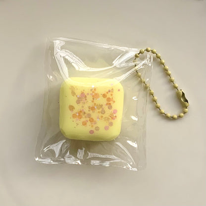 Small Square strawberry/chocolate/yellow/blue taba squishy pendant