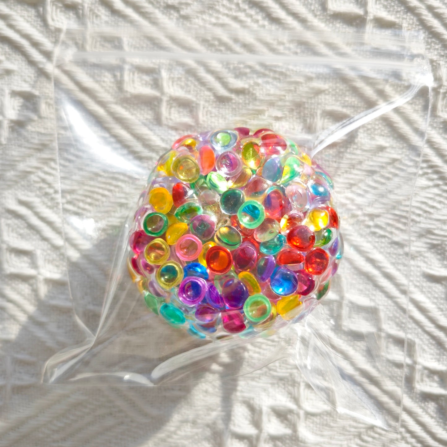 Iridescent flat bead stress ball fidget toy