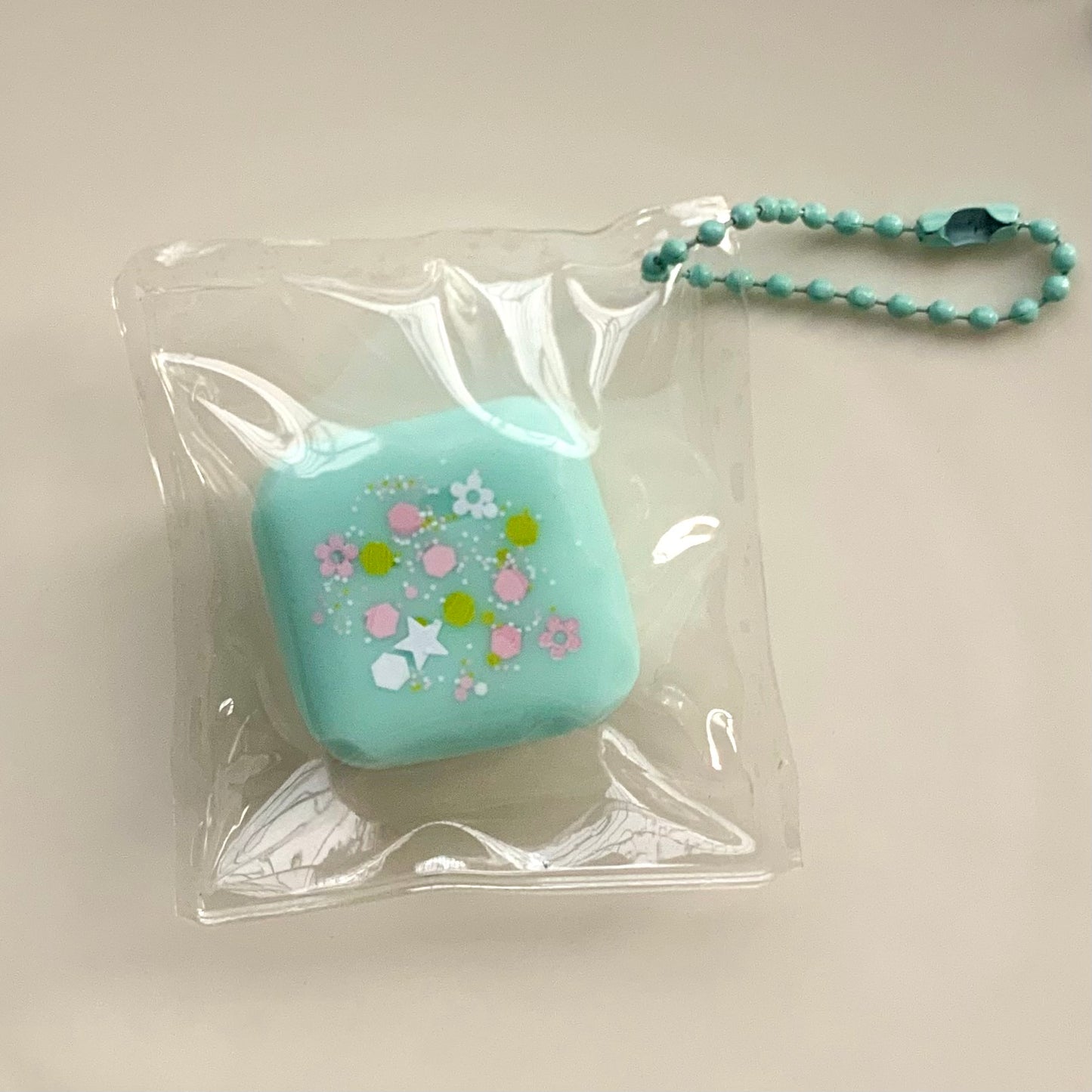 Small Square strawberry/chocolate/yellow/blue taba squishy pendant